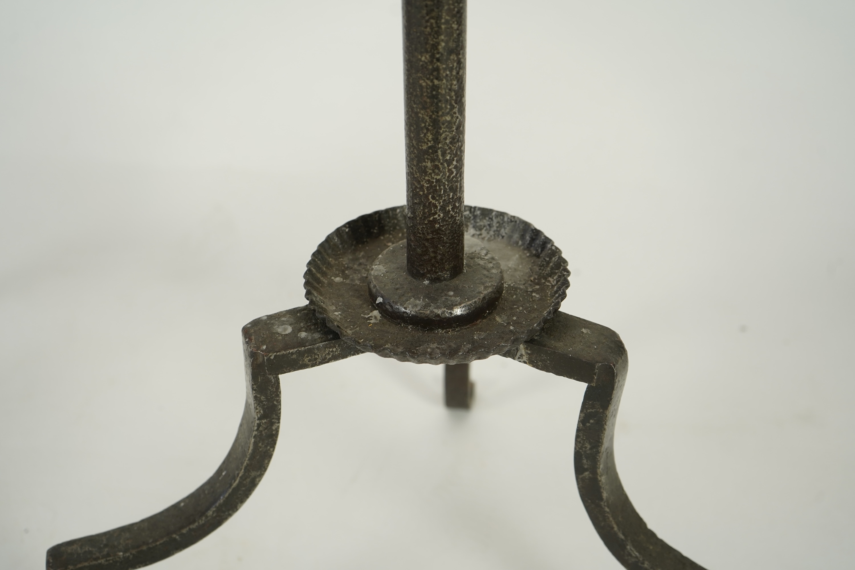 A pair of standing iron pricket candlesticks